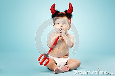 Little funny baby with devil horns and trident