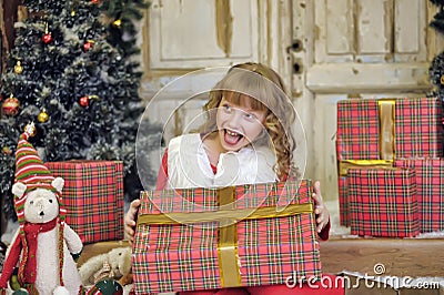 Little girl being happy about christmas present