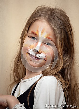 Little girl with cat painting makeup portrait