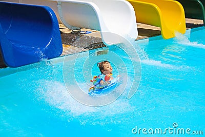 Little girl falls into the pool with water slides