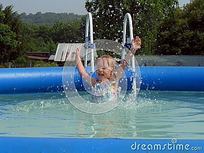 Little Girl Jumping in the Pool