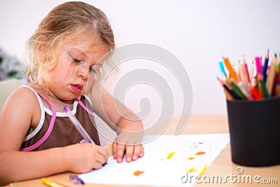 Little girl is painting