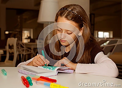 Little girl painting at home