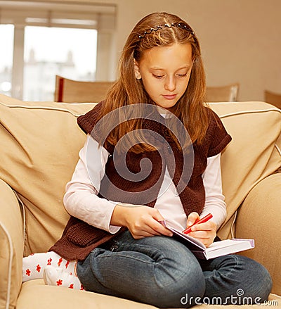 Little girl painting at home