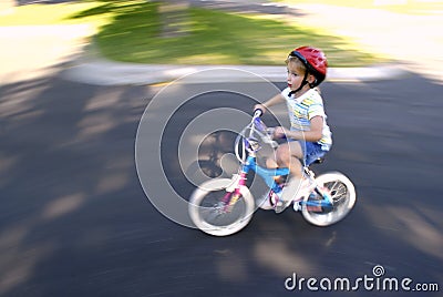 Little Girl Riding a Bike