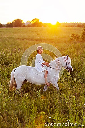 Little girl riding a horse