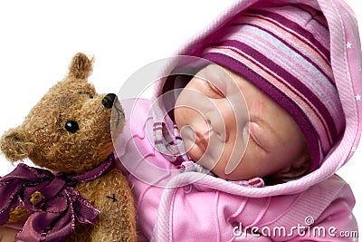 Little girl sleeps with teddy bear