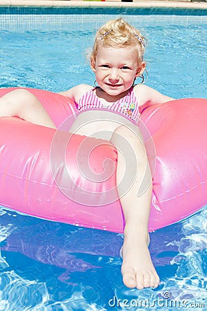 Little girl in swimming pool