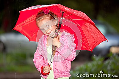 Little girl under an umbrella