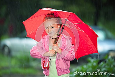 Little girl under an umbrella