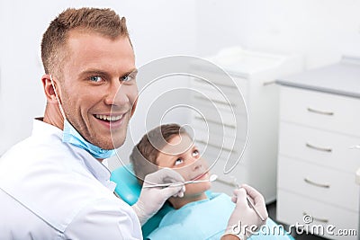 Little patient at dentist office.