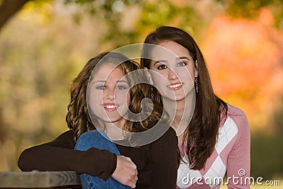 Little-Sister With Big-Sister Outdoors In Early Fall