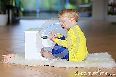 Little toddler girl plays toy piano