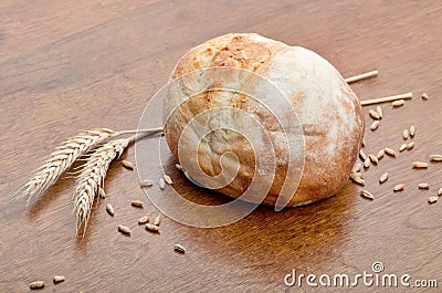Loaf of bread with grains of wheat