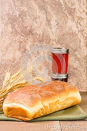 Loaf of bread with jar of jelly