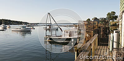 Lobster boat and pots on wharf