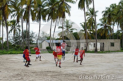 Local african soccer team during training on sand playing field