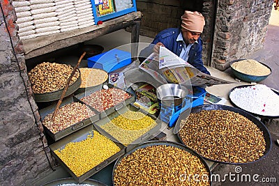 Local man selling food in the street, Pushkar, India