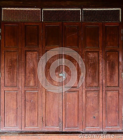 Locked wooden door with key chain