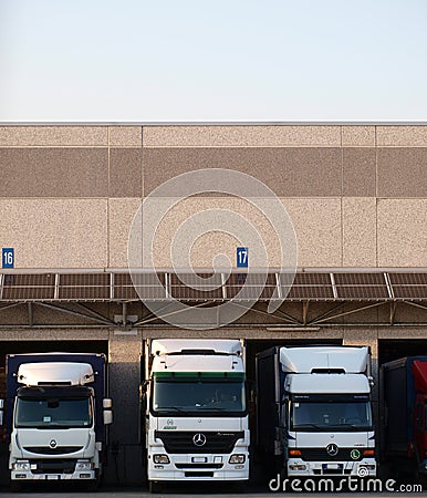 Logistic transport trucks on loading bay