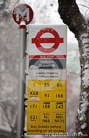 London bus stop in the snow