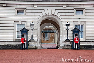 LONDON - MAY 17: British Royal guards guard the entrance to Buckingham Palace on May 17, 2013