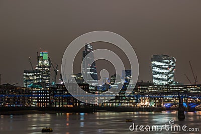 London skyline at night with reflections