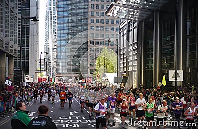LONDON, UK - APRIL 13, 2014 - London Marathon in Canary Wharf aria, massive sport event for professionals and amateurs sportsmen,