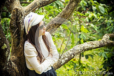 Loneliness women under the cherry tree