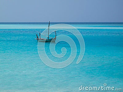 Lonely boat on blue sea