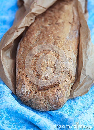 Long loaf of Home made Bread from whole wheat and rye flour in r