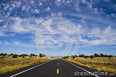 Long Straight Road under wispy clouds