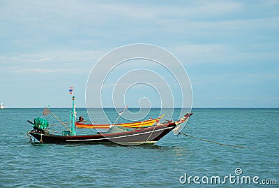 Long-tail boat in beautiful sea and tropical island with crystal