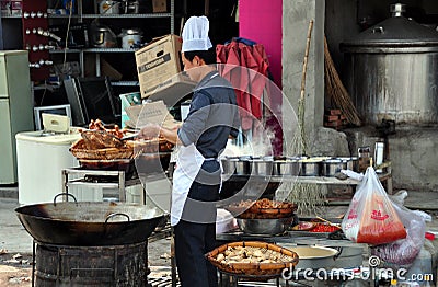 LongFeng, China: Chef Cooking at Restaurant