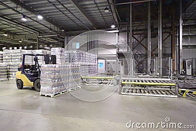 Lot of packaged beer bottles in large warehouse