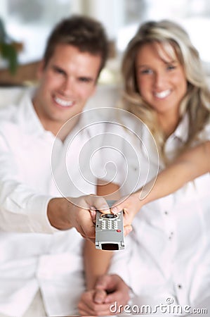 Love couple with TV remote control