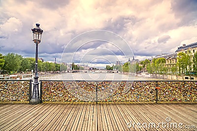 Love padlocks on Pont des Arts bridge, Seine river in Paris, France.