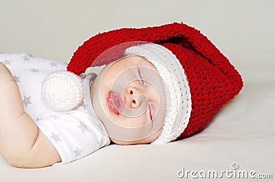 Lovely baby sleeping in a New Year s hat