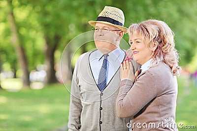 Lovely mature couple standing in park