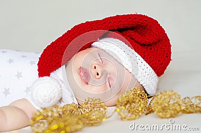 Lovely sleeping baby in a New Year s hat