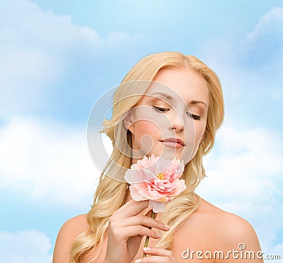 Lovely woman with peony flower