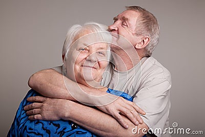 A loving, handsome senior couple