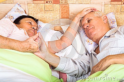 Loving seniors in bed