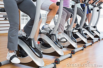 Low section of people working out at spinning class