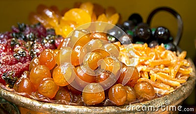 Luxurious candied fruit are in the pastry shops