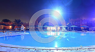 Luxurious swimming pool at night