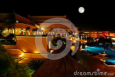 A luxury all inclusive beach resort at night