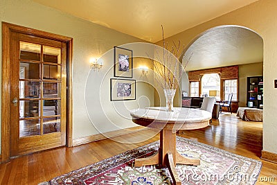 Luxury entrance home interior with round table.