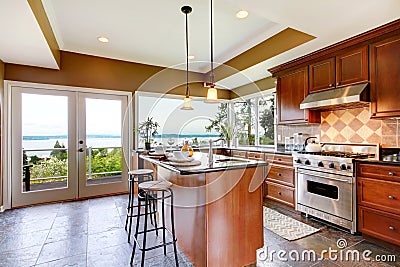 Luxury kitchen interior with water view.