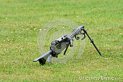 Machine gun lying on ground